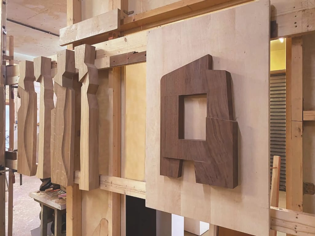 Some of the wooden pieces of the artwork.